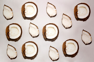 Half of coconuts isolated on white background. Coconut cream. Top View. Flat lay. Coconut pattern.