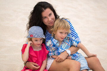 Fototapeta na wymiar Mother and kids family at tropical beach on Mauritius island