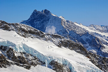 Fototapeta na wymiar Mountain peaks and glaciers in the Swiss Alps in the Grindelwald region.