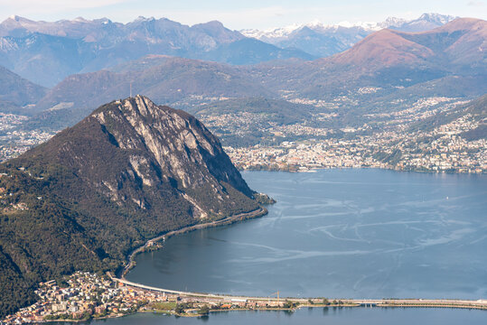 panoramic view of the lake of Lugano with  Melide,  mount San Salvatore,  mount Bre and the Alps in the background