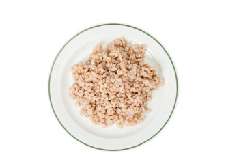 Porridge, boiled pearl barley on plate on white background