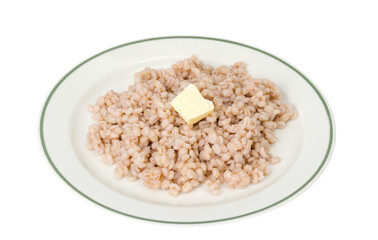 Porridge, boiled pearl barley on plate on white background