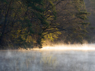Steaming lake in the morning sun