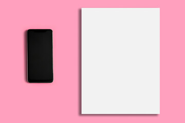 White blank sheet on a pink background. Telephone.