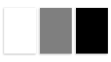 Three blank sheets on a white background. White, gray, black.
