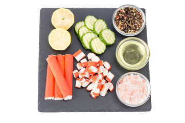 Surimi, crab sticks, slices of fresh green cucumber