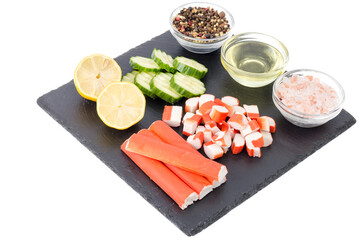 Surimi, crab sticks, slices of fresh green cucumber