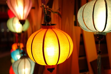 Night view of Colourful cloth lanterns lamp light shades hanging outside - ランタン 明かり 夜景