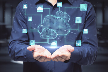 Cloud service technologies: man with opened hands and digital screen with cloud and life style signs above.