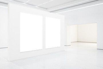 Two white blank posters on white wall in empty spacious light hall with led lights on ceiling. Mockup. 3D rendering.