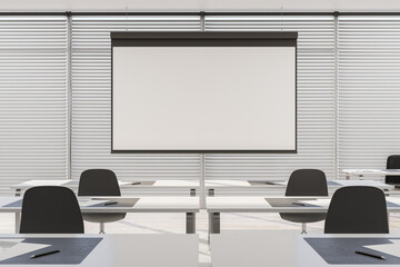 Blank white screen in the center of modern seminar room with rows of tables and chairs. Mockup. 3D rendering