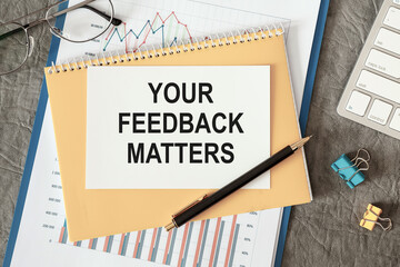 YOUR FEEDBACK MATTERS is written in a document on the office desk