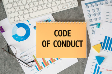 CODE OF CONDUCT is written in a document on the office desk