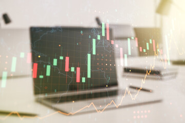 Multi exposure of abstract financial graph with world map on modern computer background, financial and trading concept