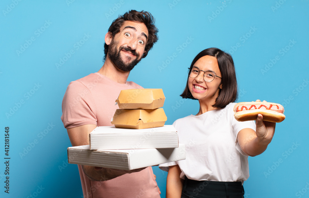 Wall mural young couple having take away fast food to home.