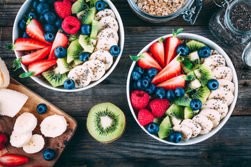 Healthy fresh fruit and berry salad with blueberry, strawberry, kiwi, raspberry, banana and chia seeds