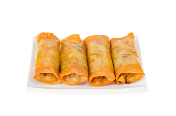 Spring rolls with chicken and vegetables on white plate
