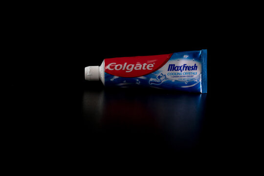 Colgate MaxFresh toothpaste tube on black background in Bucharest, Romania, 2021