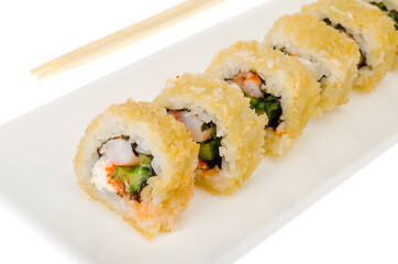 Warm prawn rolls isolated on white plate.