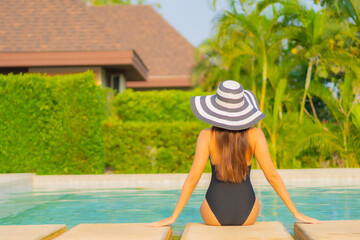 Portrait beautiful young asian woman relax smile enjoy leisure around swimming pool