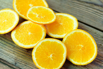 Fresh orange fruits slices on wooden background, Orange peel