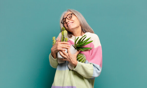 Gray Hair Pretty Woman With A Cactus