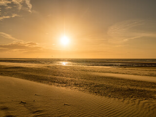 Spectacular sunset with dramatic sky at the beach near Oostkapelle, Zeeland, Netherlands