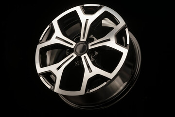 alloy wheels on a black background. New spare parts for the car or car tuning