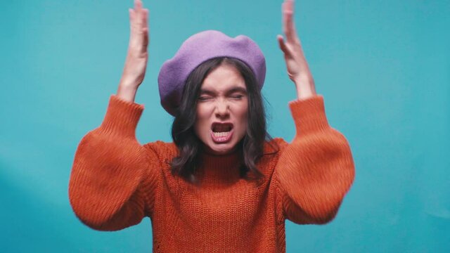 Dissatisfied Woman In Beret Gesturing While Complaining Isolated On Blue