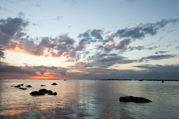 Obraz premium Aerial panoramic view of sunset over ocean.