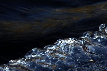 Clear ice and flowing at the rapids of Vieremänkoski, Forssa, Finland.