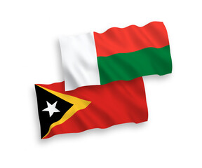 Flags of East Timor and Madagascar on a white background