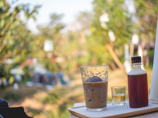 Iced coffee mug and seasoning with natural atmosphere  at coffee shop called 