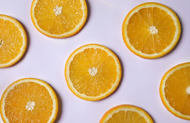 Fresh orange slices on light background, flat lay
