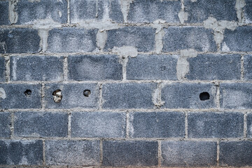 Brick wall with cement mortar. White mortar brick block wall surface texture background. old wall dirty