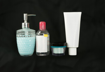 health care cosmetics body treatment toiletry bottles on a black background, no logo, Silhouette