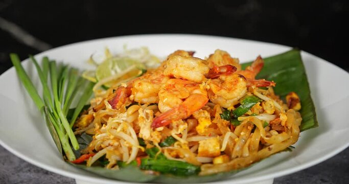 Thai traditional food, Shrimp Pad Thai, dry noodle, street food, Thai food style. Close up