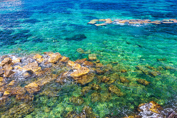 Fototapeta na wymiar Beautiful blue teal sea in Sicily, Italy at summer