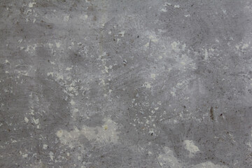 Fototapeta na wymiar old concrete wall with spots of white paint