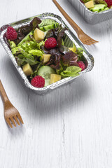 Healthy vegan take away salad in aluminum container