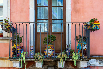 Fototapeta na wymiar Typical Sicilian balcony with flowers
