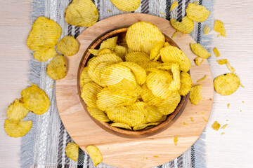 Potato flakes in bowl chips close-up. flat lay