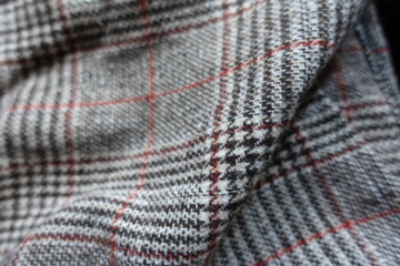 Folded red and grey Glen check woolen fabric