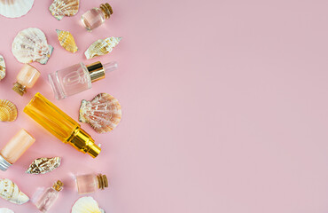 Serum or cosmetic essential oil and on a pink background.Top view, flat lay.The concept of natural cosmetics for youth and beauty