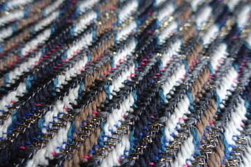 Closeup of multicolored tweed fabric with lurex
