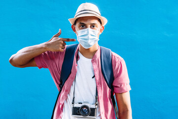 adult man pointing with his hand the mask.