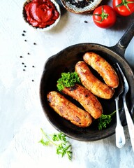 Homemade sausages from turkey (chicken) fried in a frying pan