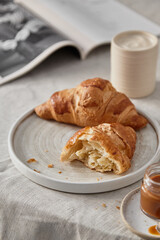 Breakfast from croissants and coffee in the kitchen