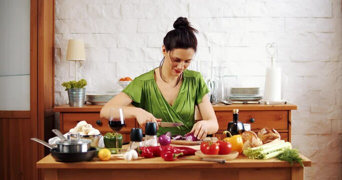 Beautiful woman preparing delicious spring food from fresh vegetables