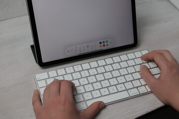person typing on a laptop
